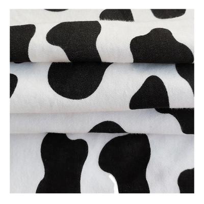 China Animal Pattern Cow Print Velboa 100% Short Plush Polyester Fabric Shrink-Resistant for sale