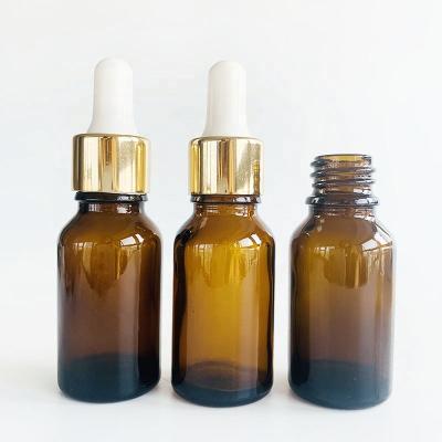 China Amber Cosmetic Packaging Bottle Custom Cosmetic 15ml Round Essential Oil Glass Bottle With Dropper for sale