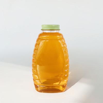 China Hot Sale 720ml Beverage Plastic Beverage Bottle , Transparent PET Honey 1000g Plastic Bottle With Aluminum Cap for sale