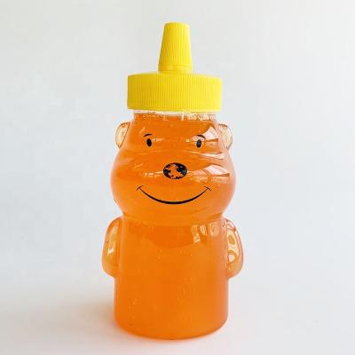 China Unique Design Transparent Food 450ml Bear Shape Honey Bottle Packaging With Spiked Plastic Lid for sale