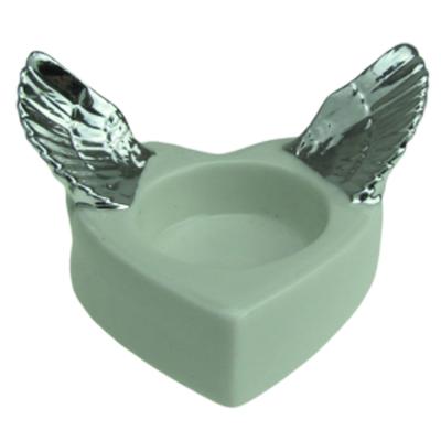 China Handmade wing silver white heart ceramic candle holder centerpieces for wedding table for sale