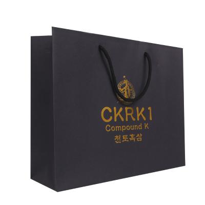 China Recycled Materials Advertising Logo Hot Selling Gold Stamping Printing Black Paper Shopping Bag for sale