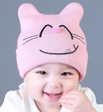 China Autumn and winter baby hood cute expression hair ball nose knit hat winter warm hat for sale