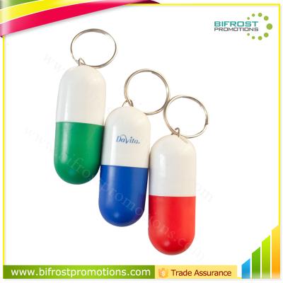 China Small Plastic ABS Pill Box Capsule Shaped Key Chain for sale