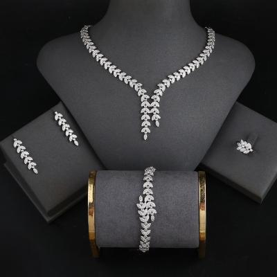 China Trendy Platinum Plated Jewelry Set Bracelet Ring Earrings And Necklace Set In Jewelry Sets Shape Luxurious Zircon Jewelry Display for sale