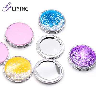 China Free Sample Liquid Custom Round Gold Glitter Logo Liquid Small Magnifying Portable Cute Compact Mirror for sale