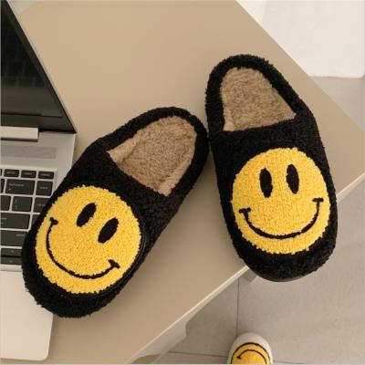 China Fashion trend high quality warm indoor home plush cotton non-slip winter slippers smile face women couple slippers for sale