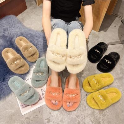 China Fashion Trend Autumn And Winter Warm Fur Wholesale Fluffy Furry Slippers Home Slippers For Women for sale