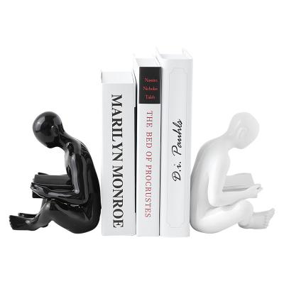 China New Ceramic Book Stand Decor Abstract Figure Decoration For TV Living Room for sale