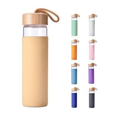 China Viable Wholesale Multi-colors Custom Made Bamboo Top Clear Glass Water Bottle for sale