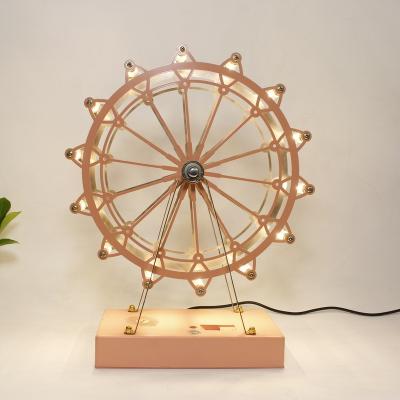 China Modern promotional products exquisite metal ferris wheel bedside light led luxury designer nordic table lamp for sale