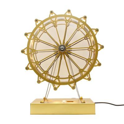 China 2022 wholesale modern holiday kids cartoon ferris wheel decoration metal bedside light modern led table lamp for sale