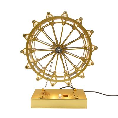 China Hot Selling Modern Metal Ferris Wheel Girls Bedroom Decoration Led Restaurant Luxury Designer Nordic Table Lamp for sale