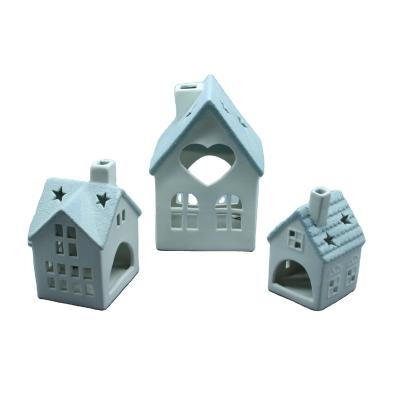 China Ceramic Christmas village house figurines ornament painted ceramic tealight Christmas house for home decoration for sale