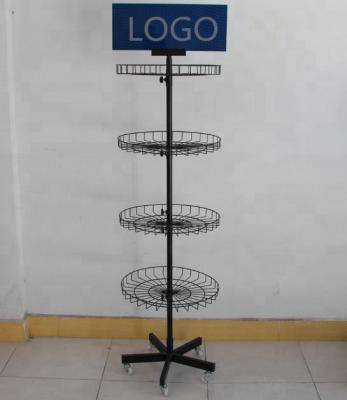 China Durable POP Floor Spinner Shop Powder Fit Basket Rotating Display Rack With Wheels for sale