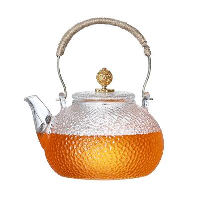 China Viable Heat Resistant Thick Glass Teapot 900ml Kettle With Hammer Pattern Household Tea Maker for sale