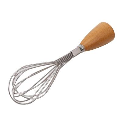 China Kitchen Instrument Smiling Stainless Steel Egg Beater Manual Stocked Beater With Beech Wood Handle for sale