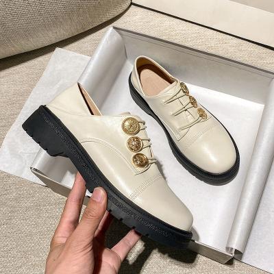 China 2022 Trend Fashion Chunky Heel Shoes British Leather Girls New PU Button White Black Decorative Women's Flat Shoes for sale