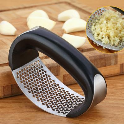 China Sustainable Food Grade Amazon Hot Selling Stainless Kitchen Tools Manual Garlic Crusher With Plastic Handle Garlic Press for sale