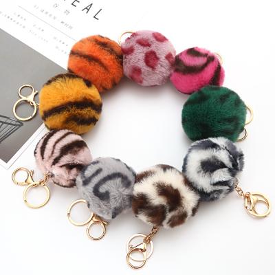 China 2021 wholesalepuff keychains style 8cm faux fur pom pom ball simple cute eco-friendly cute fluffy fur ball keychains chain for sale