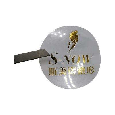 China Waterproof Self Adhesive Printing LOGO Bronzing Custom Silver Round Waterproof Transparent Sticker for sale