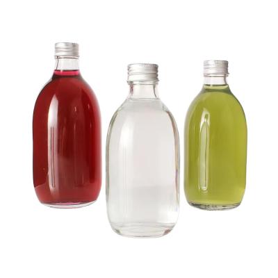 China Empty Beverage Clear 280ml 350ml Boston Round Clear 500ml Beverage Glass Bottles With Cap for sale