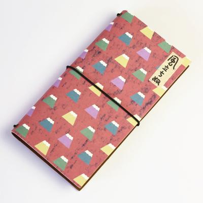 China Cute A6 Hardcover Blank Notes Travel Pocket Notebook Belt Diary Colorful Notebook With Storage Envelope for sale