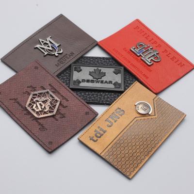 China CLOTHES wholesale embossed custom metal leather crafty butterfly crafty PU leather garment label PU leather label for sale