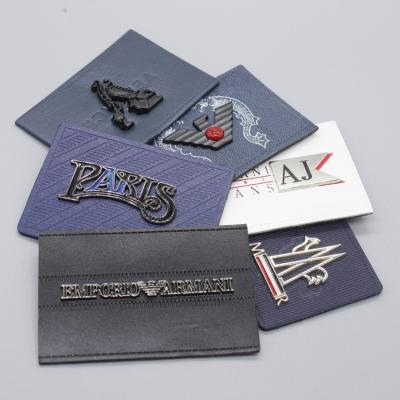 China CLOTHING good quality and fashion brand jeans PU label patch embossed clothes custom metal logo label PU leather label garment for sale