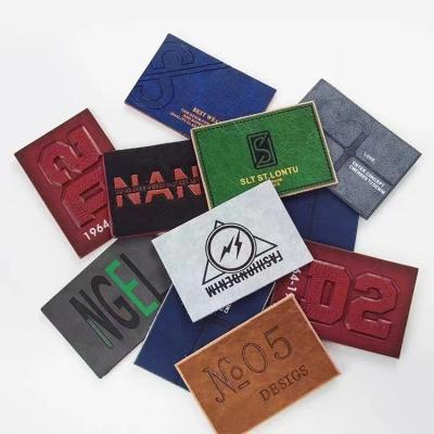 China CLOTHES Good Quality Custom Jeans Pants Brands Genuine Leather Label Tags Embossed Logo Stitch Labels for sale