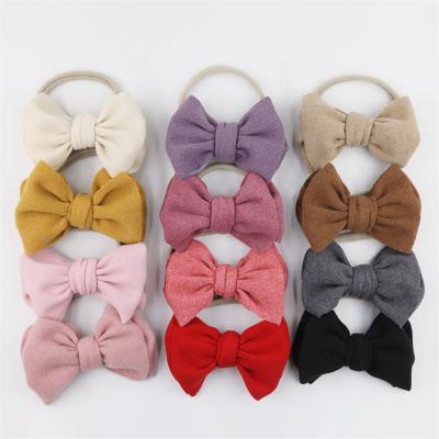 China Hot sale fashion big color cashmere elasticity girl hair bow pure baby hair band hair bow children hairpins hair clips for sale