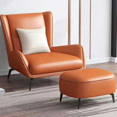 China Easy Installation Customized Stainless Steel Deep Orange Back Leg Single Genuine Leather Sofa With Stool For Living Room for sale