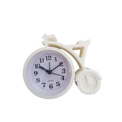 China 2022 Plastic The Best Selling Bike Shape Plastic Digital Pendulum Table Desk Clock For Children s Day Gift for sale