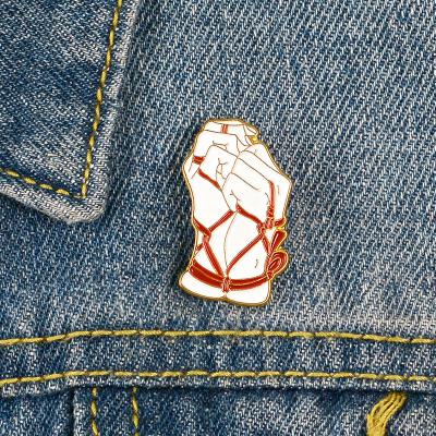 China Fashion C&J Drop Oil Enamel Badge Bundled Hands Tied Shirt Badge Art Brooch for sale