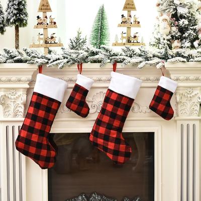 China YQ-603 Fashionable Red Black Plaid Christmas Stocking With Faux Fur Cuff Socks For Holiday Christmas Stocking for sale