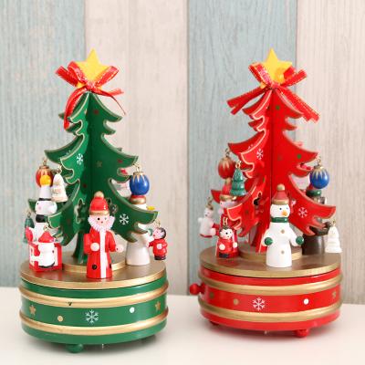 China HU-209 Fashionable Amazon Christmas Tree Rotate Music Box Mini Wooden Tabletop Christmas Ornament for sale