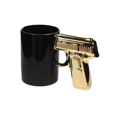 China Viable Custom Ceramic White Black Gun Shaped Creative Simple Handle Water Coffee Mug Milk Tea Mug for sale