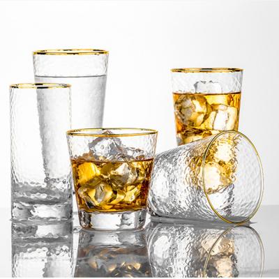 China Viable Tumbler High Manufacturer Custom Logo Gold Rim Hammered Clear Ball Water Glass Cups for sale