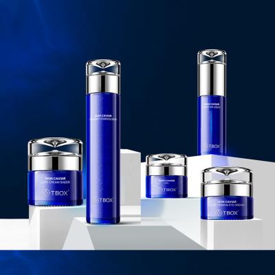 China Cosmetic Customized Beautiful 30ml 100ml Glass Cosmetic Bottle With Hot Stamping Logo Cobalt Silver Blue Glass Jar for sale