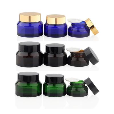 China 15g 30g 50g Shoulder Cosmetic Amber Green Blue Oblique Glass Cream Jar Cosmetic Packaging Container With Lid for sale