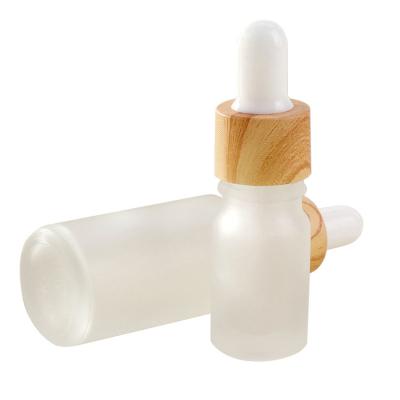 China Essential Oil Cosmetic Cosmetic Glass Bottles 5 10 15 20ml 30ml 50 100ml Frosted Glass Bottle Water Transfer Wood Grain Dropper for sale