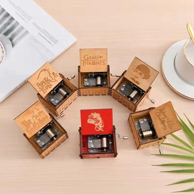 China Wholesale Custom Hot Sale Hand Crank Mini Animate Diy Harry Wooden Music Box Christmas Laser Engraved Music Boxes For Kids for sale