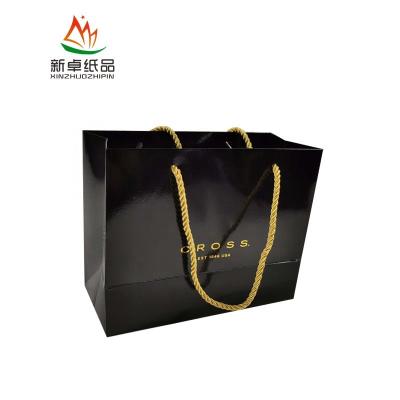 China Recycled Materials Custom Maker Flat Recycled Shop Washable Flower Printed Small Logo Square Gift Wrapping Black Paper Bag for sale