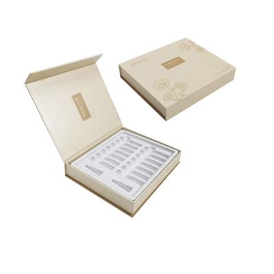 China Luxury Recycled Magnet Materials Custom Materials Shallow Cardboard Ivory Rigid Clamshell Cosmetic Magnetic Essential Oil Box for sale