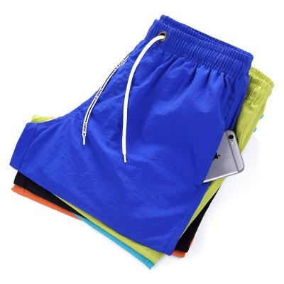 China OEM Style Anti-wrinkle Custom Logo Waterproof Boardshorts Men Surfing Board Shorts Beach Shorts Swim Trunks For Men With Mesh Lining for sale