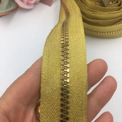 China Sustainable Plastic Gold Cloth Gold Tooth Code Loaded Resin Long Chain for sale