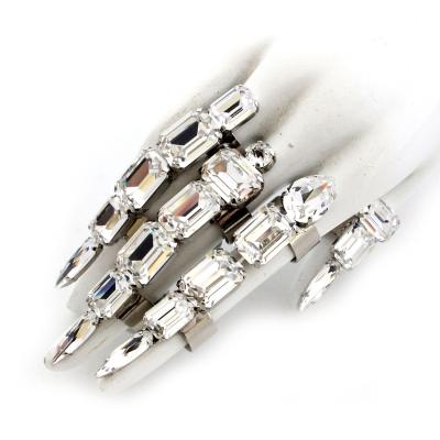 China Bespoke TRENDY crystal-embellished five-ring bracelet in clear crystal tones. Gunmetal plating. Adjustable cuff and buckle straps. for sale