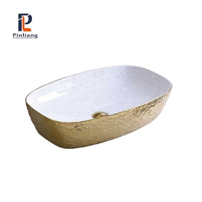 China Scratch Proof And Gold Hand Face Wash Basin Art Ceramic White Decorative Luxury Hotel Bathroom Basin Gold Rectangular Sink for sale