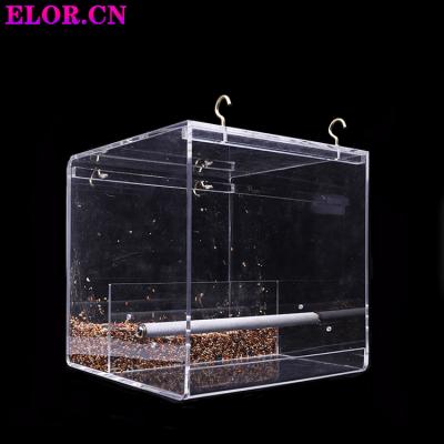 China Anti-spray Acrylic Parrot Window Bird Cage Stand Non-automatic Transparent Customized Bird Feeding Feeder With Two Hooks for sale