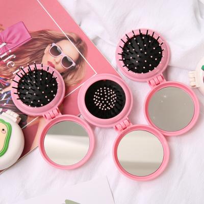 China Mini Folding Comb Airbag Massage Portable Cartoon Girls Round Pocket Travel Hairbrush With Mirror Plastic Hair Accessories for sale